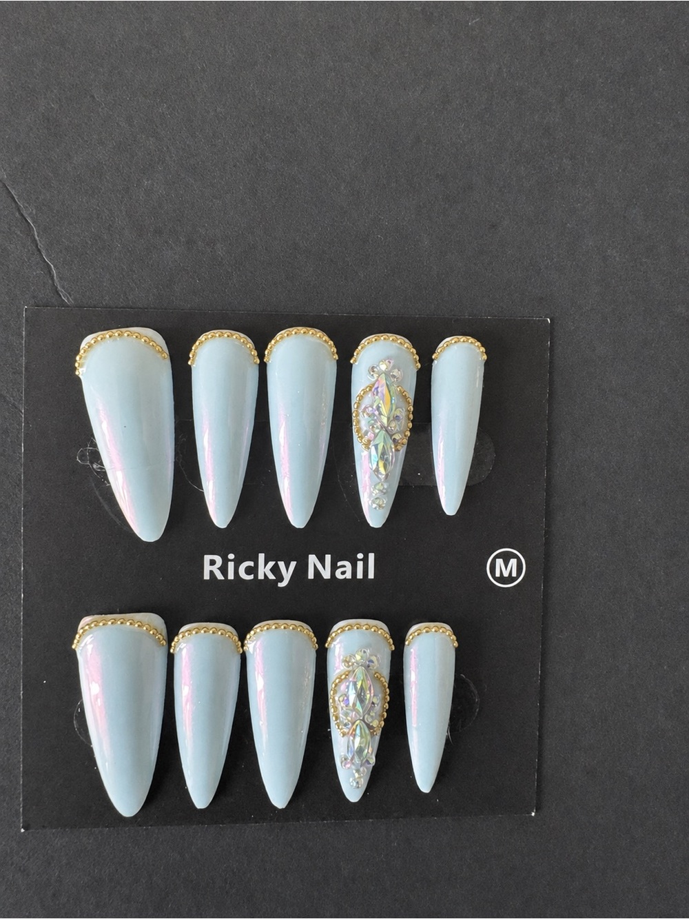 Iridescent Light Blue Stiletto Press-On Nails with Gold Trim (Ricky Brand)